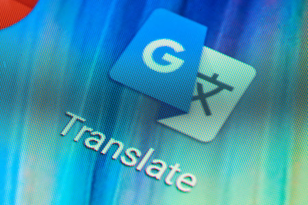 BUENOS AIRES, ARGENTINA - JULY 18, 2019: Macro shot of Google Translate mobile application icon on Android phone screen. One of the most popular translators.のeditorial素材