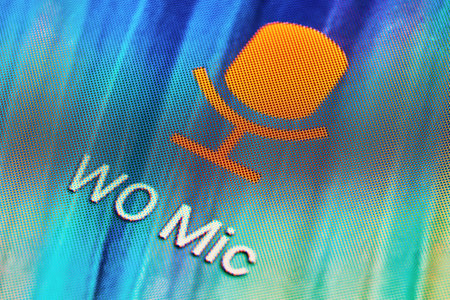 BUENOS AIRES, ARGENTINA - JULY 18, 2019: Macro shot of WoMic mobile application icon on Android...