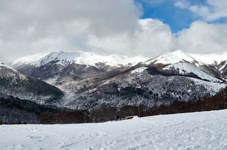 White landscape of snowy mountains and forests on a cloudy day seen from Bayo Hill (Cerro Bayo),...