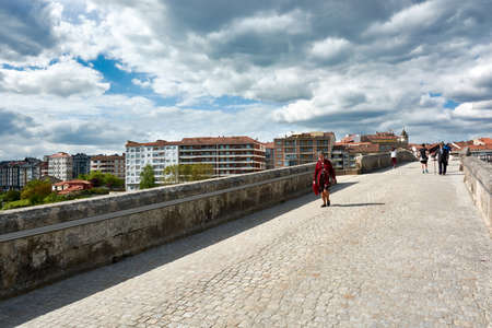 APRIL 27, 2018 - OURENSE, GALICIA, SPAIN: View of the street on the famous Roman Bridge of Ourense...