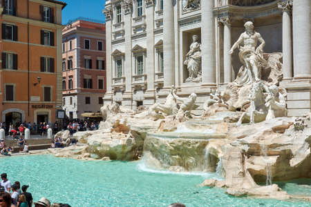 MAY 17, 2017 - ROME, ITALY: View of the front of the Trevi Fountain with sculptures and water pool in Rome, Italy, surrounded by tourists on a sunny spring dayのeditorial素材