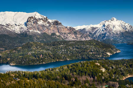 View of beautiful landscape of snowy mountains and green trees from Cerro Campanario (Campanario...
