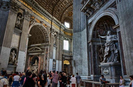 VATICAN CITY, VATICAN - MAY 17, 2017: Interior view of the Basilica of Saint Peter in the Vatican with sculptures and crowd of tourists.のeditorial素材