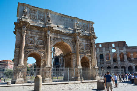 ROME, ITALY - MAY 17, 2017: View of the Arch of Constantine in Rome, with the Coliseum in the background, surrounded by tourists.のeditorial素材