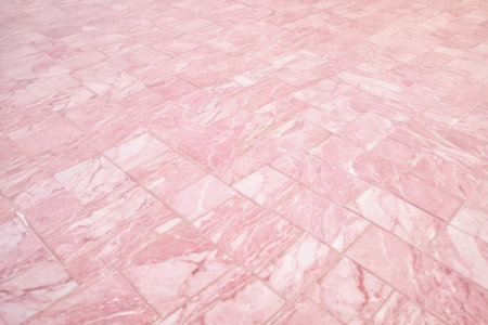 Texture of tiled floor or wall with subtle pastel pink colour, background or graphic element for your design or project.の素材
