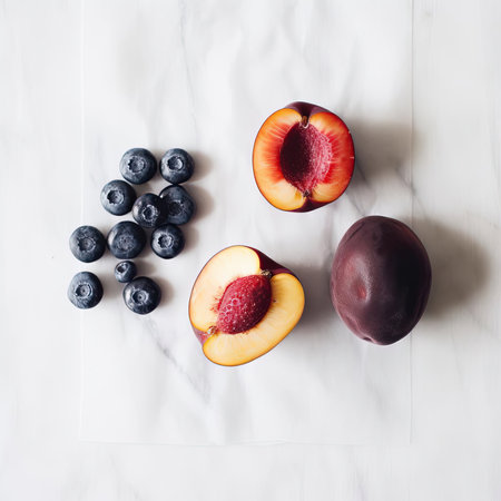 Flat lay composition with fresh blueberries and peach on white backgroundの素材