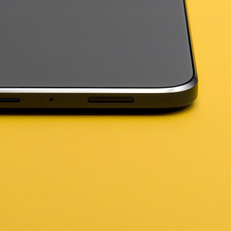 Smartphone with blank screen on yellow background, close-upの素材