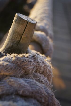 Beautiful shot of a wharft with wood and lasso