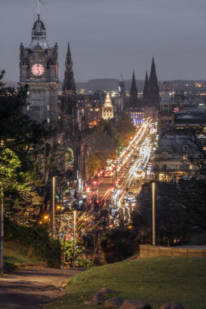 Long exposure image from Calton Hill of Balmoral Hotel and Princes Street at night with traffic lightsの写真素材