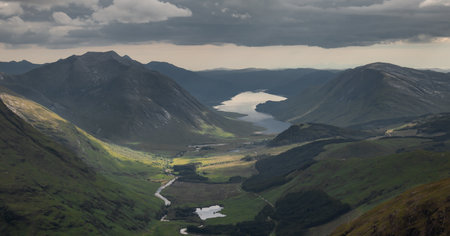 View of the valley of Glen Etive from the Stob Dubh peak, summit of the Buachaille Etive Beag, with Loch Etive in the background. Highlands of Scotland. Munro bagging. Hiking. Hill Walkingの写真素材