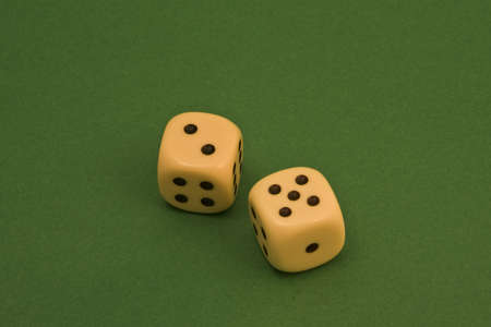 dice on a green rugの写真素材