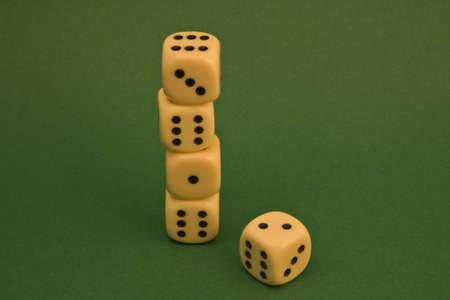 dice on a green rug