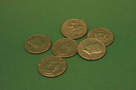 coins on a green rugの写真素材