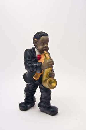 figure of ceramics that represents a musician of jaz touching an instrumentの写真素材