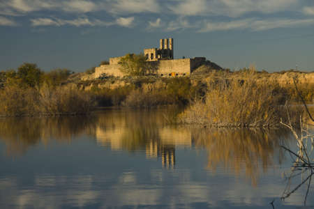lake with reflections on water and trees in autumnの写真素材
