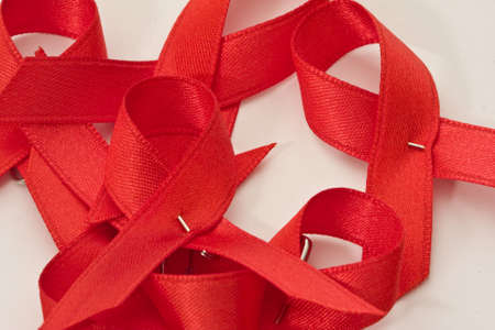 red ribbon commemorating the day of AIDSの写真素材