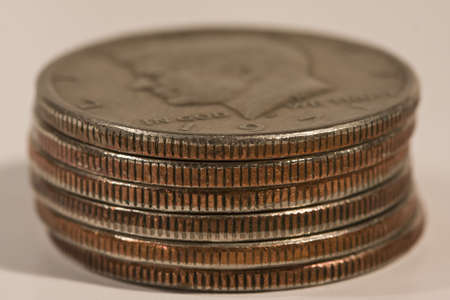 A sink of coins of half a dollar on white background