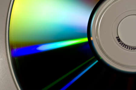 Reflections of colors on the surface of a CD-ROMの写真素材