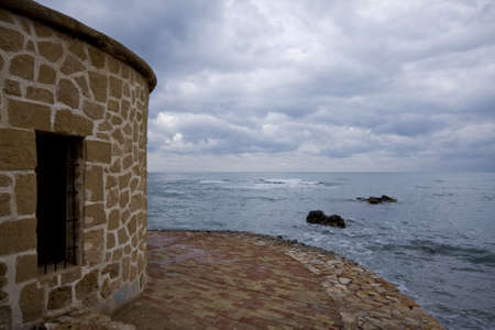 Tower next to the seaの写真素材