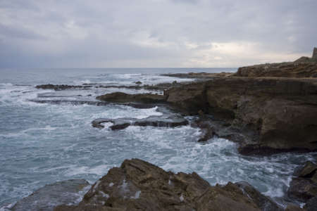 Pools among the rocks by the sea on a winter day の写真素材