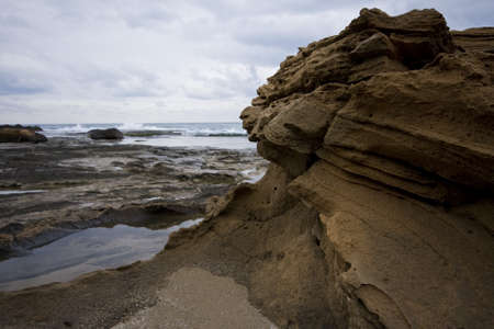 Pools among the rocks by the sea on a winter day の写真素材