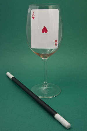Displays an ace of hearts in a glass with a magic wandの写真素材