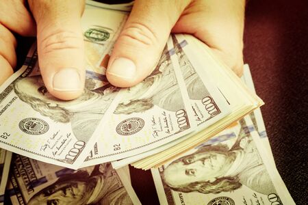 Caucasian hands counting dollar banknotes. Counting or spending USD money banknote, business and...