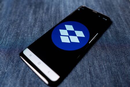 Odessa, Ukraine - October 26, 2019: Dropbox app. Dropbox logo visible on smartphone screen. Denim background. Soft focusのeditorial素材