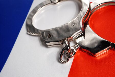 Handcuff on the flag of France. Close-up, copy spaceの写真素材