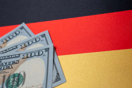 Germany national flag and the dollar bills. Business and finance concept, soft focusの写真素材