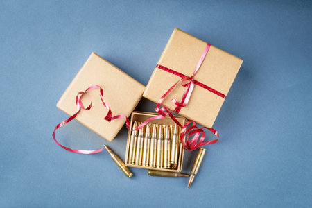 Rifle cartridges in gift box. 223 caliber ammo cartridges and three gift cardboard box. Top viewの写真素材