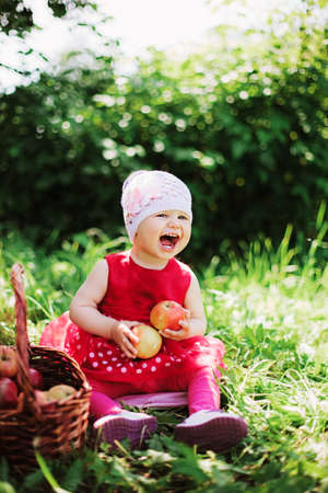 Young girl eating applesの写真素材