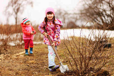 Children are the gardeners in the garden.の写真素材