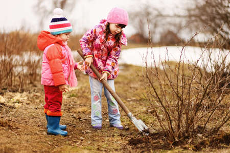 Children are the gardeners in the garden.の写真素材
