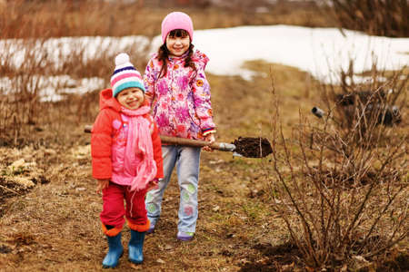 Children are the gardeners in the garden.の写真素材