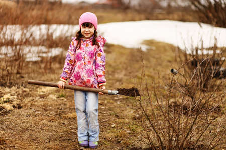Children are the gardeners in the garden.の写真素材