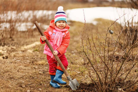 Children are the gardeners in the garden.の写真素材