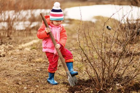 Children are the gardeners in the garden.の写真素材