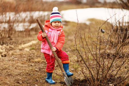 Children are the gardeners in the garden.の写真素材