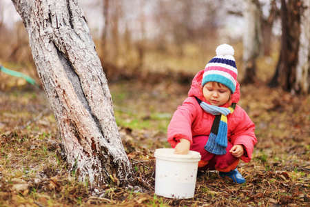 The child in garden happiness outdoors work.の写真素材