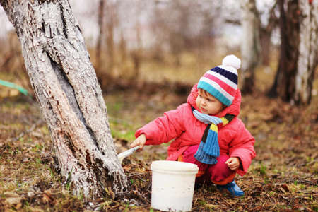 The child in garden happiness outdoors work.の写真素材