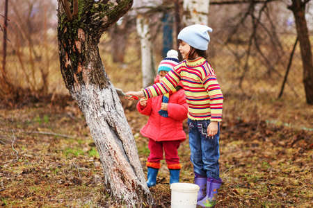 The child in garden happiness outdoors work.の写真素材