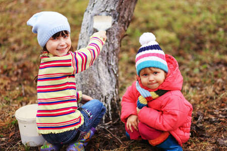 The child in garden happiness outdoors work.の写真素材