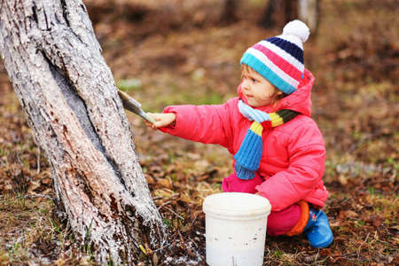 The child in garden happiness outdoors work.の写真素材