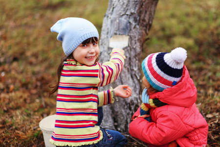 The child in garden happiness outdoors work.の写真素材