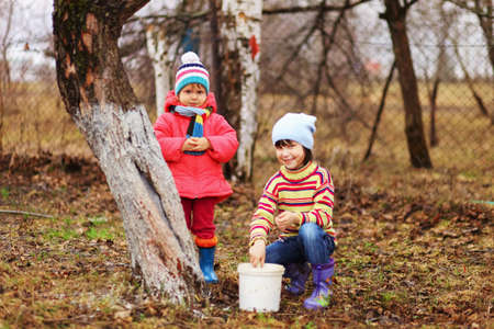 The child in garden happiness outdoors work.の写真素材