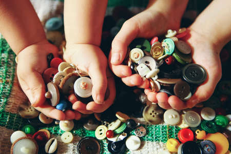 The buttons sewing close up a background.の写真素材