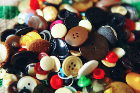 The buttons sewing close up a background.の写真素材
