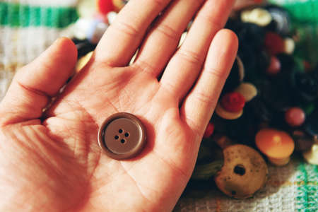 The buttons sewing close up a background.の写真素材