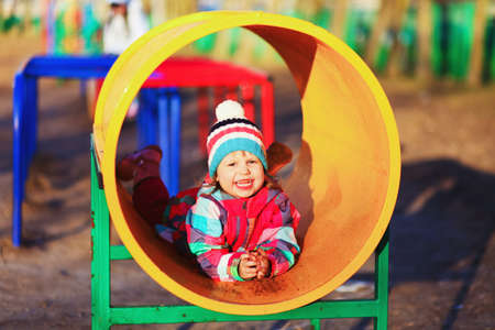 The Children happy outdoors play in playground.の写真素材